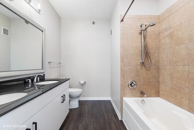 757 N Orleans St Unit 1509, Chicago, IL 60654 - full bathroom with double vanity, shower / bathtub combination, baseboards, toilet, and wood finished floors