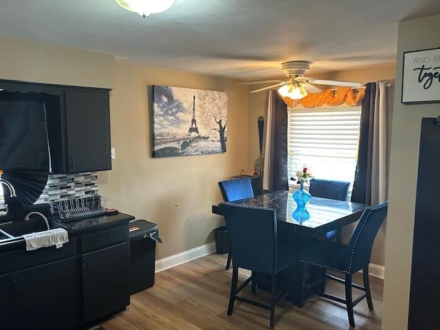 746 May St, Calumet City, IL 60409 - dining area with baseboards, a ceiling fan, and wood finished floors