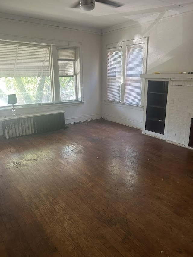 8039 S Ingleside Ave, Chicago, IL 60619 - unfurnished room with radiator heating unit, dark wood-style floors, crown molding, and ceiling fan