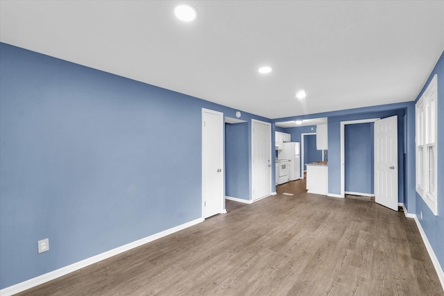 713 E Michigan Ave, Urbana, IL 61801 - spare room featuring baseboards, dark wood finished floors, and recessed lighting
