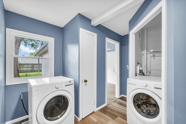 713 E Michigan Ave, Urbana, IL 61801 - washroom featuring washer / dryer, baseboards, and light wood-style floors