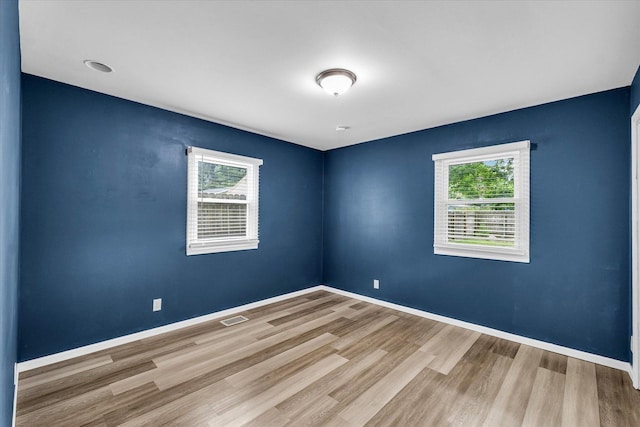 713 E Michigan Ave, Urbana, IL 61801 - unfurnished room featuring wood finished floors and baseboards