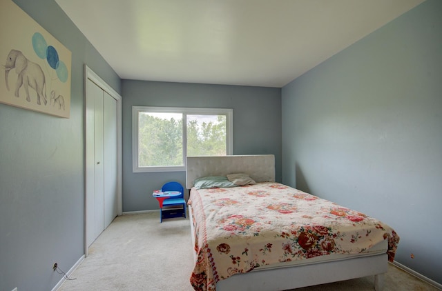 649 Sundance Dr, Bolingbrook, IL 60440 - bedroom featuring light carpet, a closet, and baseboards