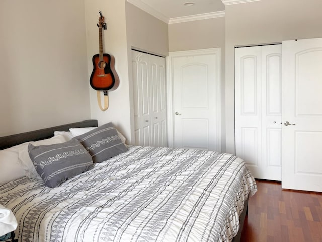 4950 N Western Ave Unit Ph2, Chicago, IL 60625 - bedroom featuring multiple closets, ornamental molding, and wood finished floors
