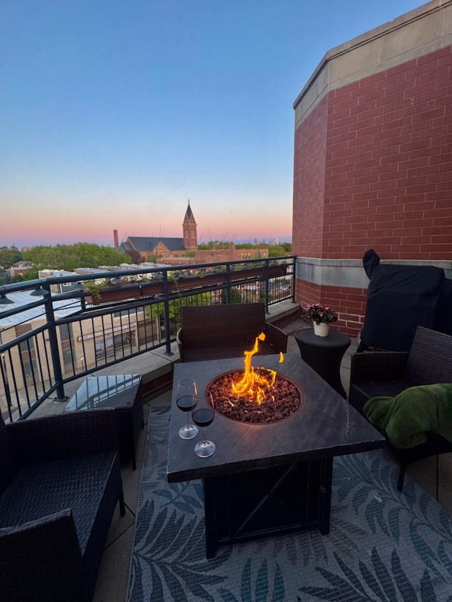 4950 N Western Ave Unit Ph2, Chicago, IL 60625 - patio terrace at dusk with a fire pit