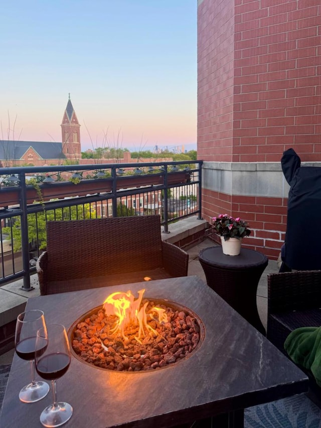 4950 N Western Ave Unit Ph2, Chicago, IL 60625 - balcony at dusk with a fire pit