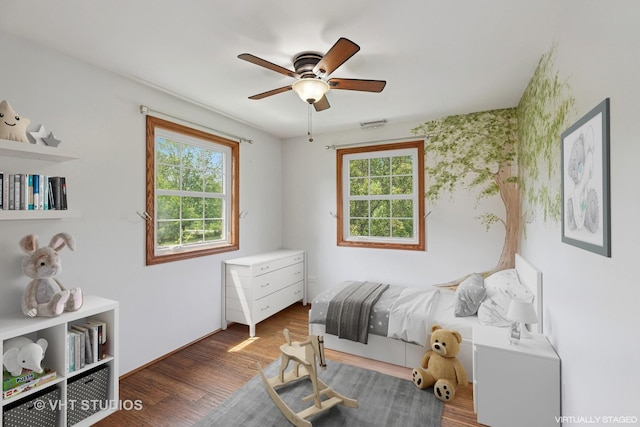 4335 Dewey Ave, Matteson, IL 60443 - bedroom featuring multiple windows, wood finished floors, and ceiling fan