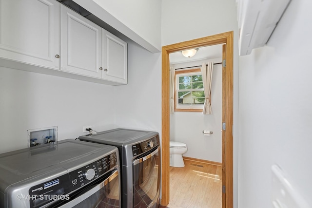 4335 Dewey Ave, Matteson, IL 60443 - washroom with washer and dryer, cabinet space, and light wood-style floors