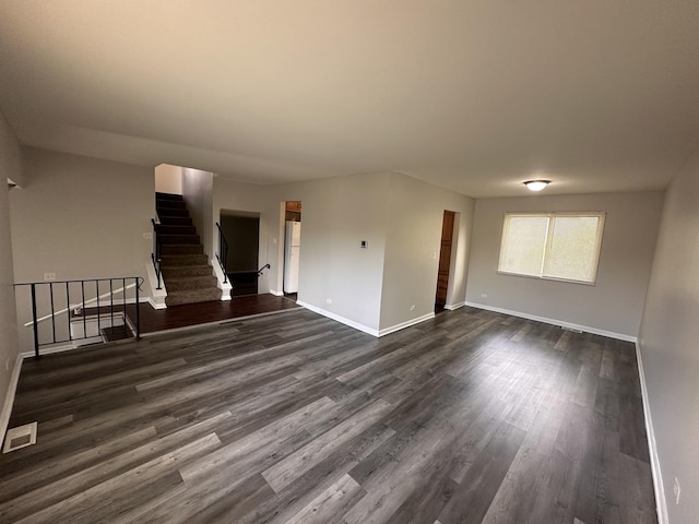 5911 Timberlane Rd, Matteson, IL 60443 - unfurnished living room with dark wood-style flooring, baseboards, and stairs