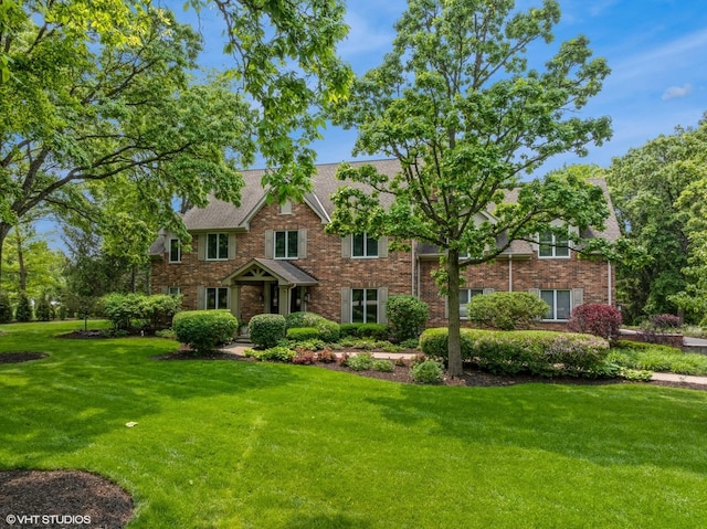 26874 N Countryside Lake Dr, Mundelein, IL 60060 - view of front of home featuring a front yard and brick siding