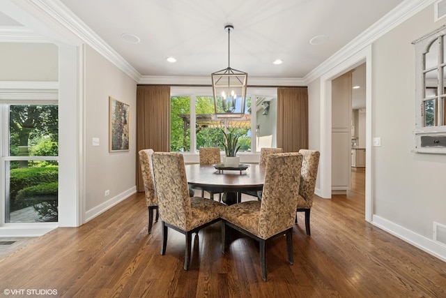 26874 N Countryside Lake Dr, Mundelein, IL 60060 - dining room with plenty of natural light, baseboards, wood finished floors, crown molding, and recessed lighting