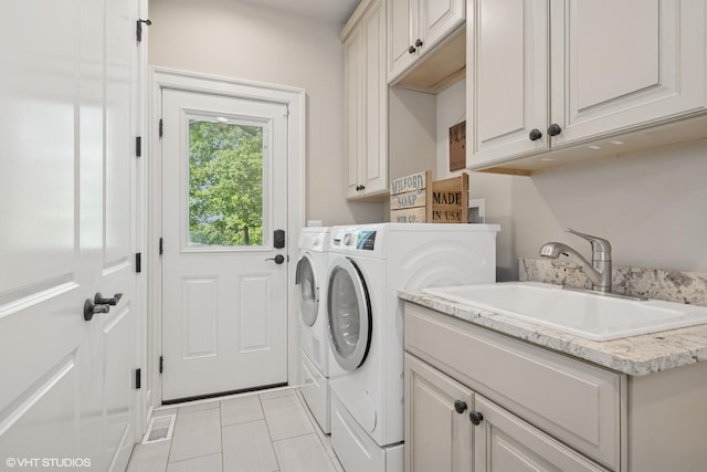 26874 N Countryside Lake Dr, Mundelein, IL 60060 - laundry room with cabinet space, independent washer and dryer, and light tile patterned floors