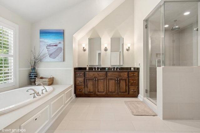 26874 N Countryside Lake Dr, Mundelein, IL 60060 - full bathroom featuring double vanity, a stall shower, a bath, wainscoting, and tile patterned floors
