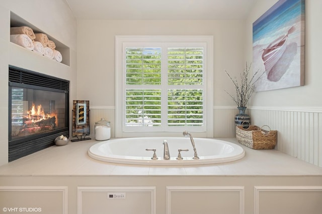 26874 N Countryside Lake Dr, Mundelein, IL 60060 - bathroom featuring a glass covered fireplace