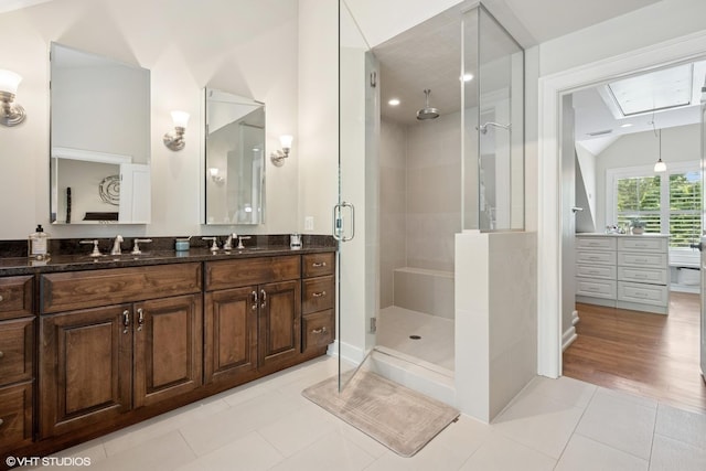 26874 N Countryside Lake Dr, Mundelein, IL 60060 - bathroom with a stall shower, vanity, tile patterned floors, and lofted ceiling