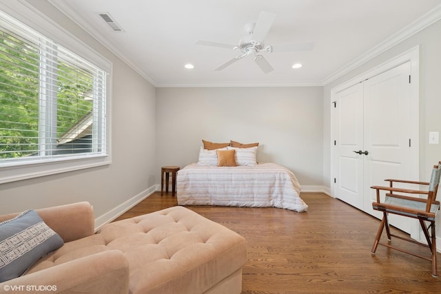 26874 N Countryside Lake Dr, Mundelein, IL 60060 - bedroom with wood finished floors, recessed lighting, baseboards, crown molding, and a closet