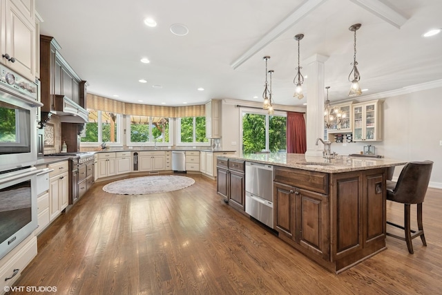 26874 N Countryside Lake Dr, Mundelein, IL 60060 - kitchen featuring stainless steel appliances, a sink, a large island, dark wood-style floors, and recessed lighting