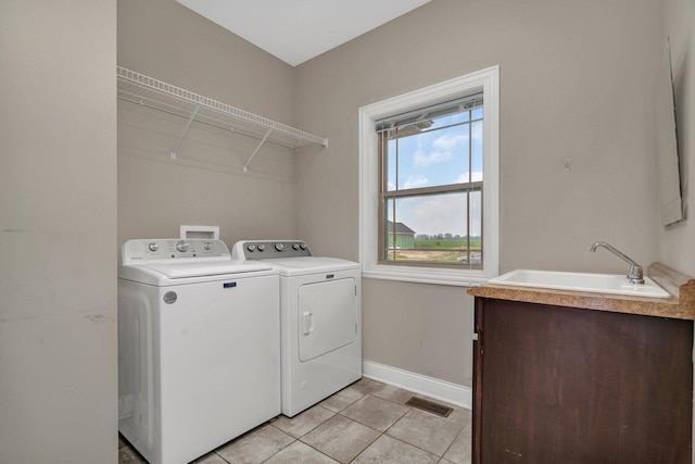 1200 Farmstone Dr, Diamond, IL 60416 - laundry area featuring washing machine and dryer, baseboards, and light tile patterned flooring