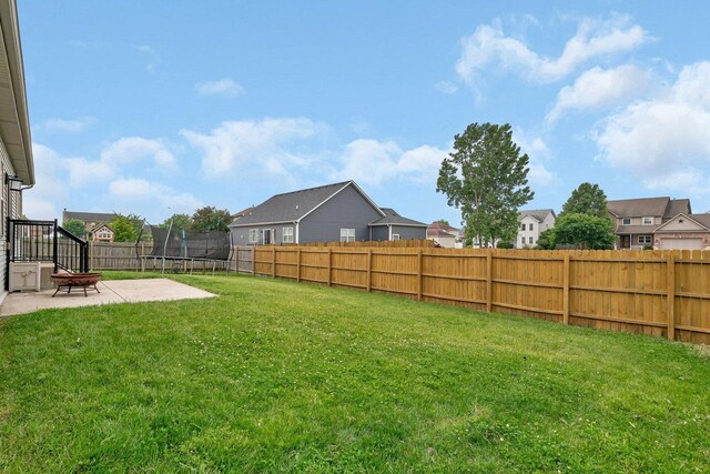 1200 Farmstone Dr, Diamond, IL 60416 - view of yard with a patio, a trampoline, and a residential view
