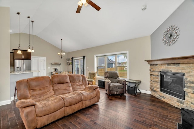 1200 Farmstone Dr, Diamond, IL 60416 - living area with a stone fireplace, a ceiling fan, dark wood-type flooring, a chandelier, and high vaulted ceiling