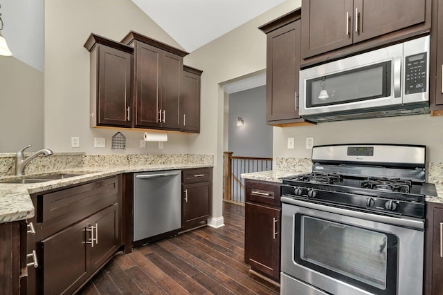 1200 Farmstone Dr, Diamond, IL 60416 - kitchen featuring appliances with stainless steel finishes, a sink, vaulted ceiling, dark wood-type flooring, and dark brown cabinetry