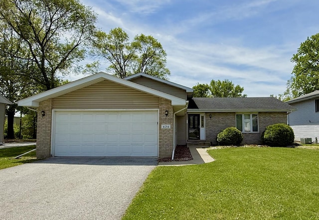 424 E Clark St, Glenwood, IL 60425 - view of front of home featuring brick siding, asphalt driveway, a front lawn, a garage, and central AC unit