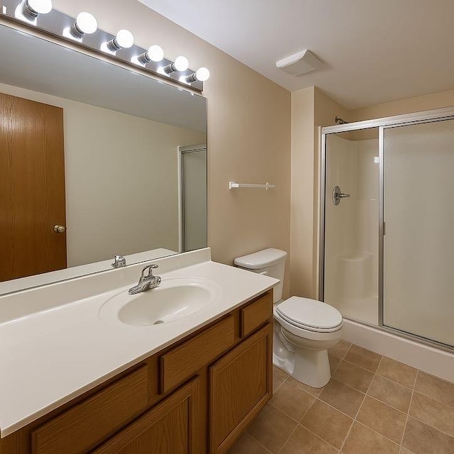 424 E Clark St, Glenwood, IL 60425 - bathroom with tile patterned floors, a shower stall, vanity, and toilet