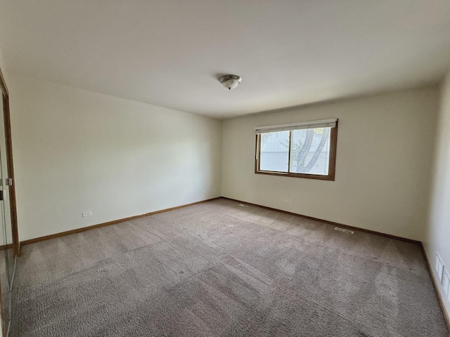 424 E Clark St, Glenwood, IL 60425 - carpeted empty room featuring baseboards