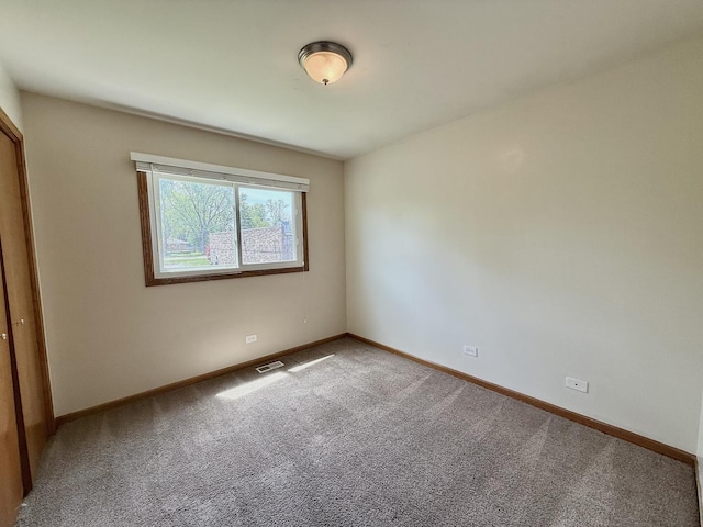 424 E Clark St, Glenwood, IL 60425 - unfurnished bedroom featuring carpet flooring and baseboards