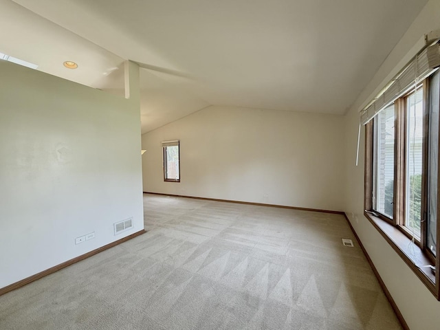 424 E Clark St, Glenwood, IL 60425 - carpeted empty room featuring baseboards and vaulted ceiling