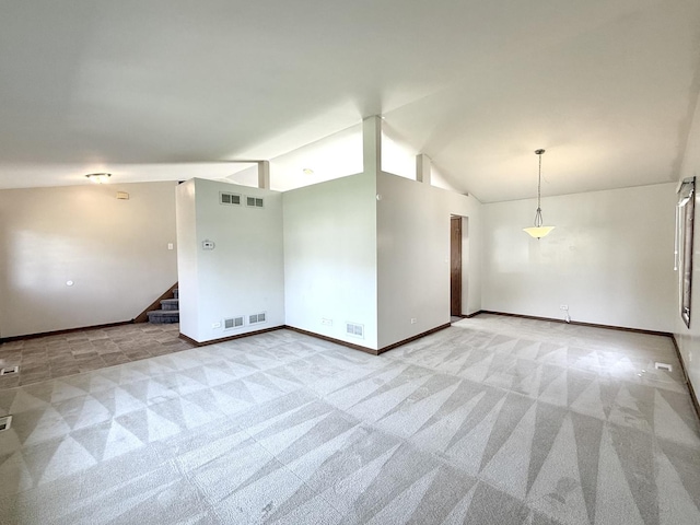 424 E Clark St, Glenwood, IL 60425 - unfurnished room with lofted ceiling, light carpet, stairway, and baseboards