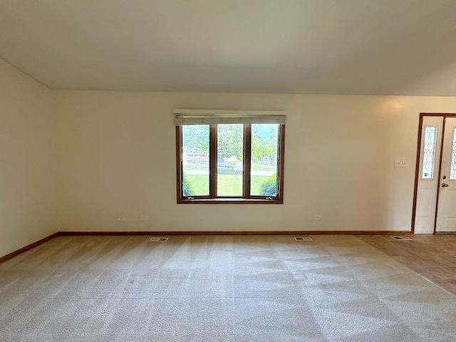424 E Clark St, Glenwood, IL 60425 - carpeted empty room with plenty of natural light and baseboards