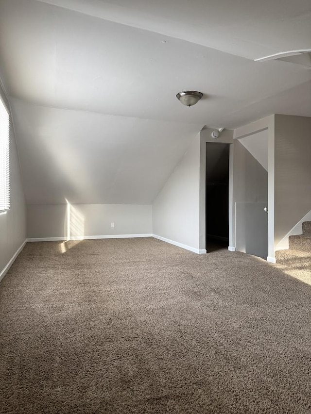 2219 S 13th Ave, Broadview, IL 60155 - bonus room featuring vaulted ceiling, carpet flooring, baseboards, and stairway
