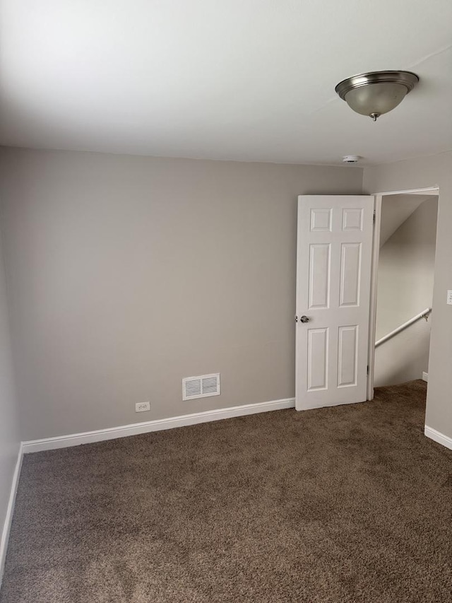 2219 S 13th Ave, Broadview, IL 60155 - unfurnished room with dark carpet and baseboards