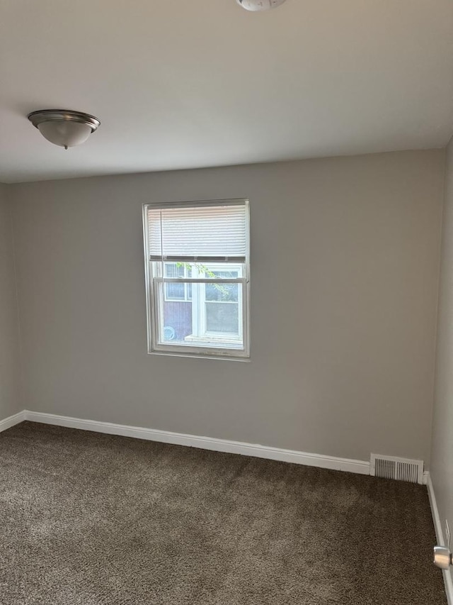 2219 S 13th Ave, Broadview, IL 60155 - carpeted empty room with baseboards