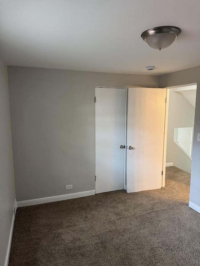 2219 S 13th Ave, Broadview, IL 60155 - unfurnished bedroom featuring carpet flooring, a closet, and baseboards