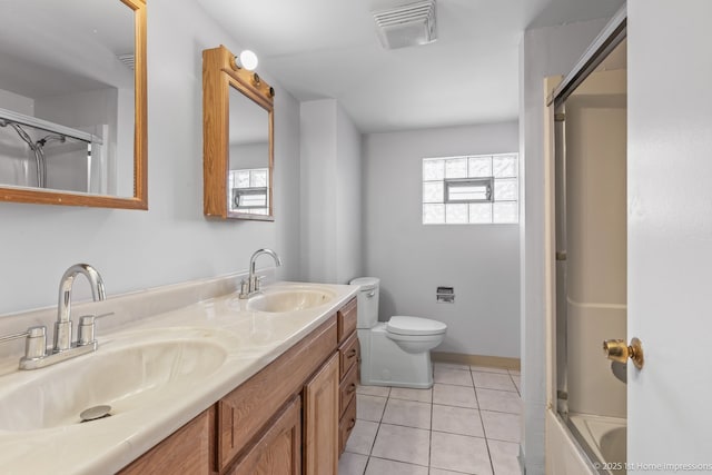 2312 S 1st Ave, North Riverside, IL 60546 - full bathroom featuring double vanity, toilet, tile patterned floors, and combined bath / shower with glass door