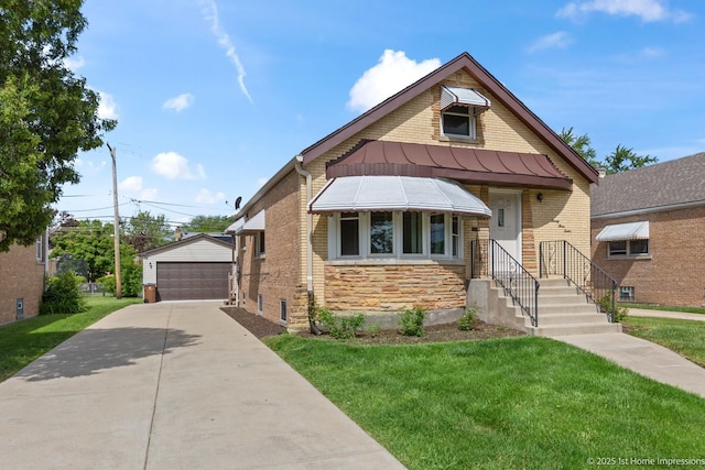 2312 S 1st Ave, North Riverside, IL 60546 - view of front of home featuring stone siding, an outbuilding, a detached garage, a standing seam roof, and a front lawn