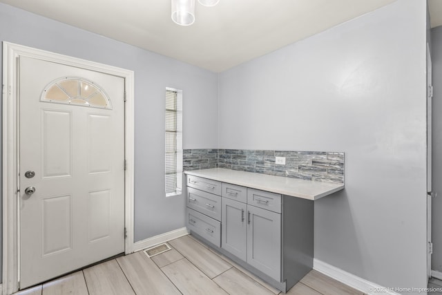 2312 S 1st Ave, North Riverside, IL 60546 - interior space featuring baseboards, wood finished floors, and decorative backsplash