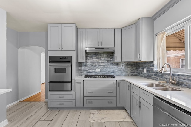 2312 S 1st Ave, North Riverside, IL 60546 - kitchen featuring gray cabinetry, stainless steel appliances, a sink, under cabinet range hood, and a warming drawer