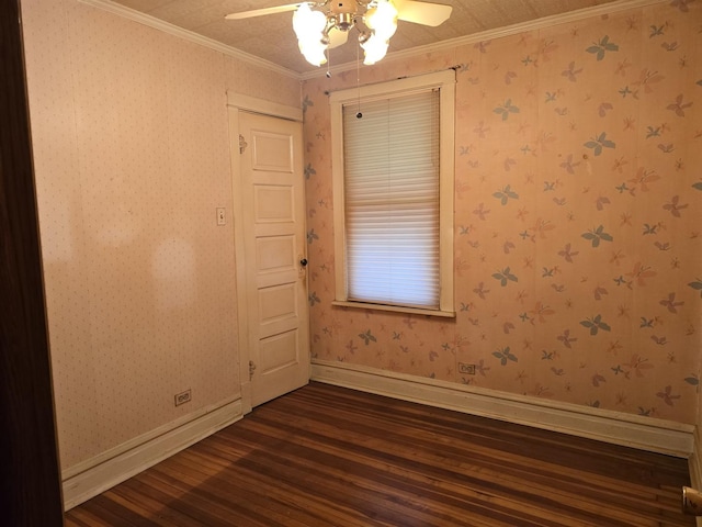 3905 N Oak Park Ave, Chicago, IL 60634 - empty room featuring dark wood-style flooring, a ceiling fan, baseboards, and ornamental molding