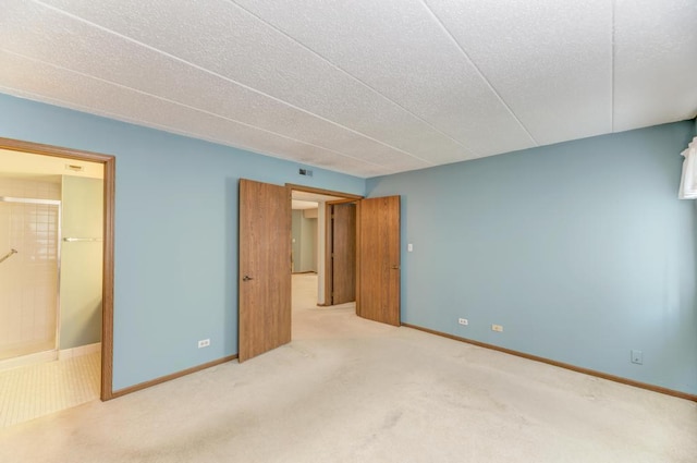 464 S President St Unit 101, Carol Stream, IL 60188 - unfurnished bedroom with carpet flooring, baseboards, and a textured ceiling