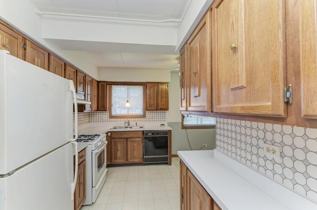 464 S President St Unit 101, Carol Stream, IL 60188 - kitchen with white appliances, a sink, backsplash, and light countertops