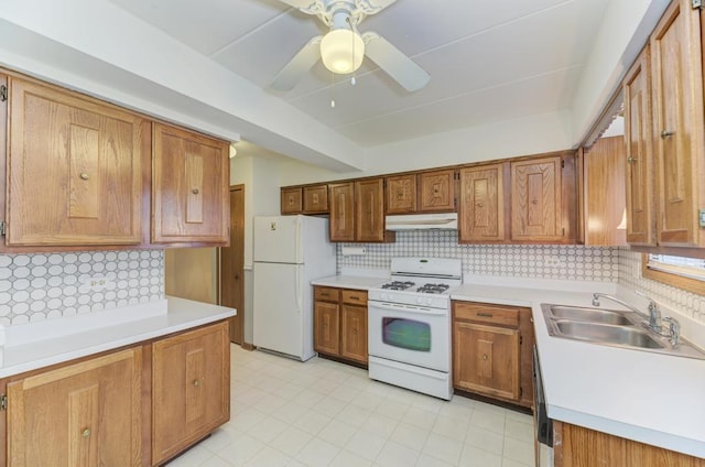 464 S President St Unit 101, Carol Stream, IL 60188 - kitchen with white appliances, a sink, under cabinet range hood, and backsplash