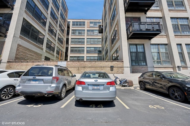 3963 W Belmont Ave Unit 140, Chicago, IL 60618 - view of property featuring uncovered parking