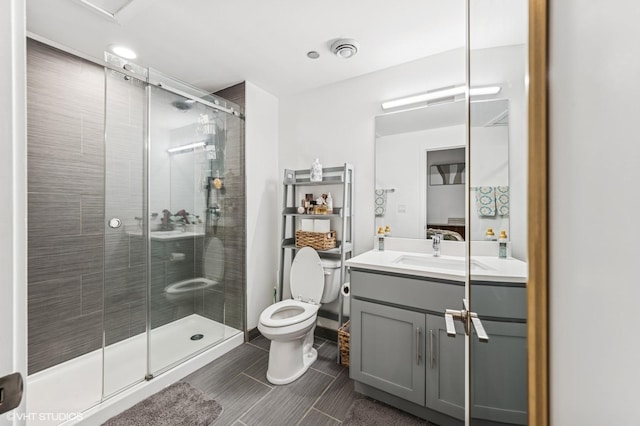 3963 W Belmont Ave Unit 140, Chicago, IL 60618 - full bathroom featuring toilet, vanity, and a shower stall