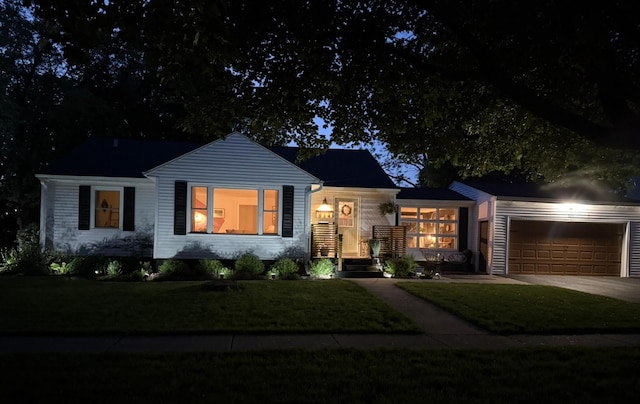 324 W Crystal Lake Ave, Crystal Lake, IL 60014 - ranch-style house with a garage, concrete driveway, and a front lawn
