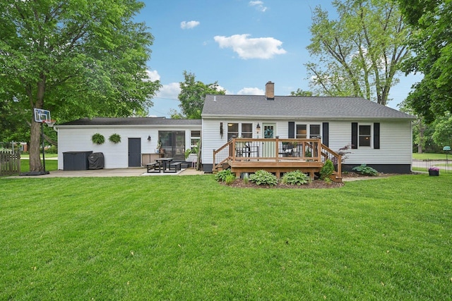 324 W Crystal Lake Ave, Crystal Lake, IL 60014 - back of property with a wooden deck, a chimney, a patio, and a yard