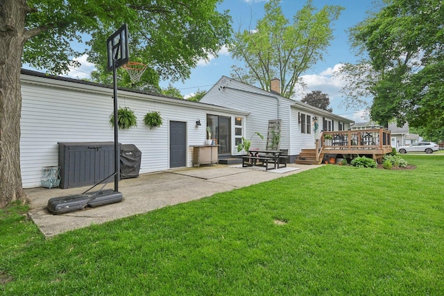 324 W Crystal Lake Ave, Crystal Lake, IL 60014 - rear view of house with a lawn, a deck, a patio area, and a chimney