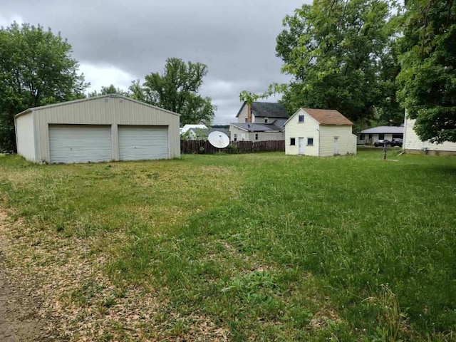 202 W Fourth St, Leaf River, IL 61047 - view of yard with a detached garage and an outdoor structure